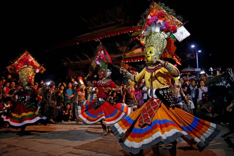 Masked lakhey dancers performing at a night festival in Kathmandu Durbar Square
