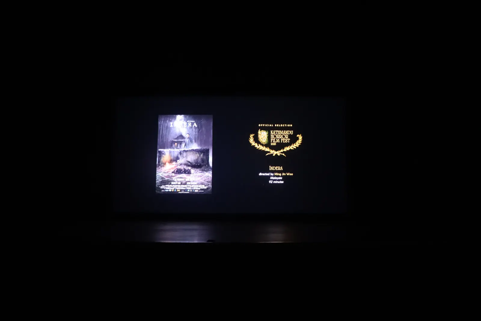 The official selection card for Indera on the festival screen